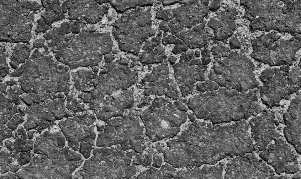 news63.1_damaged-asphalt-surface-black-white-abstract-background-texture-design-road-old-worn-grey-gray-pavement-rock-stone